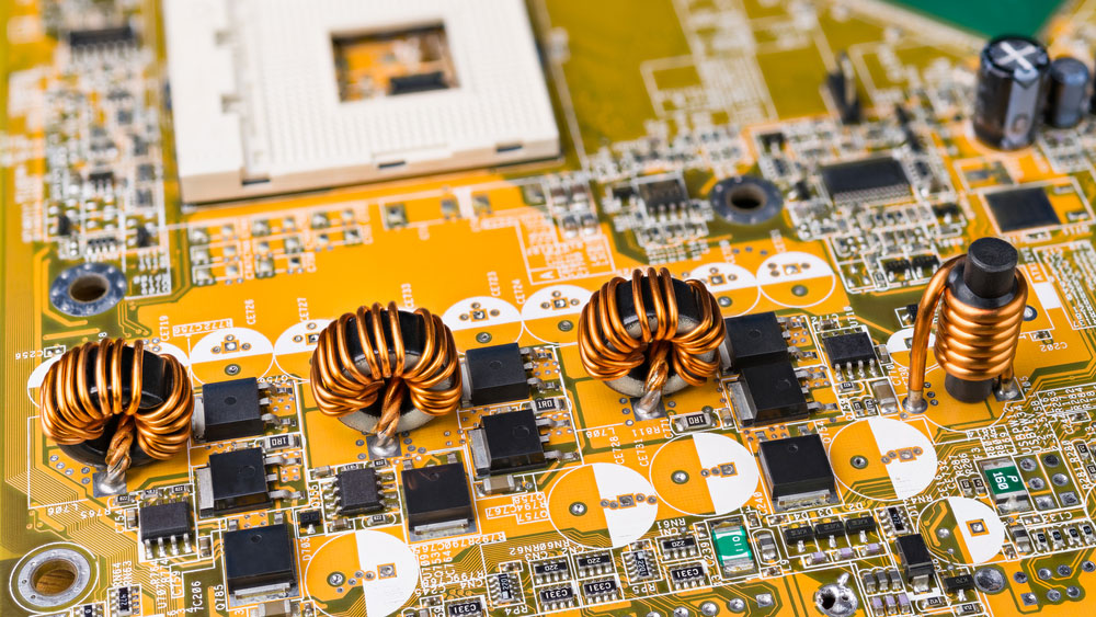 four inductors with ferromagnetic core on circuit board